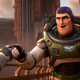 Fictional human Buzz greets a colleague while wearing his iconic spacesuit in Pixar's Lightyear trailer.